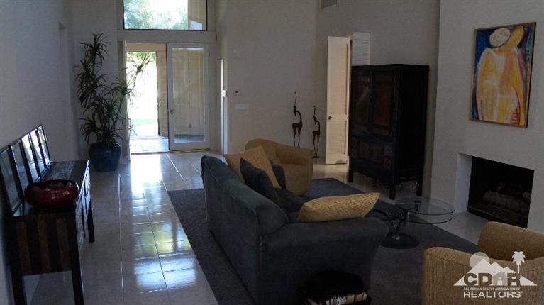 2 Lincoln Place Rancho Mirage, CA 92270 - Photo 12 of 25 a living room with furniture and a fireplace
