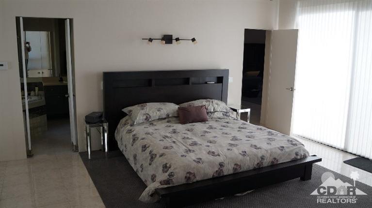 2 Lincoln Place Rancho Mirage, CA 92270 - Photo 13 of 25 a bedroom with a bed and a dresser