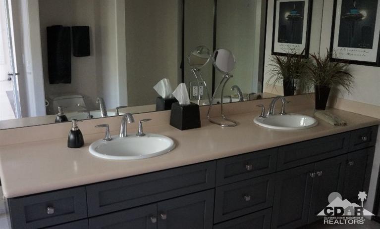 2 Lincoln Place Rancho Mirage, CA 92270 - Photo 15 of 25 a bathroom with double vanity sinks and a mirror
