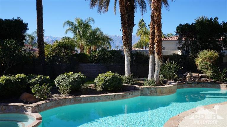 2 Lincoln Place Rancho Mirage, CA 92270 - Photo 18 of 25 a view of a house with a yard and garden