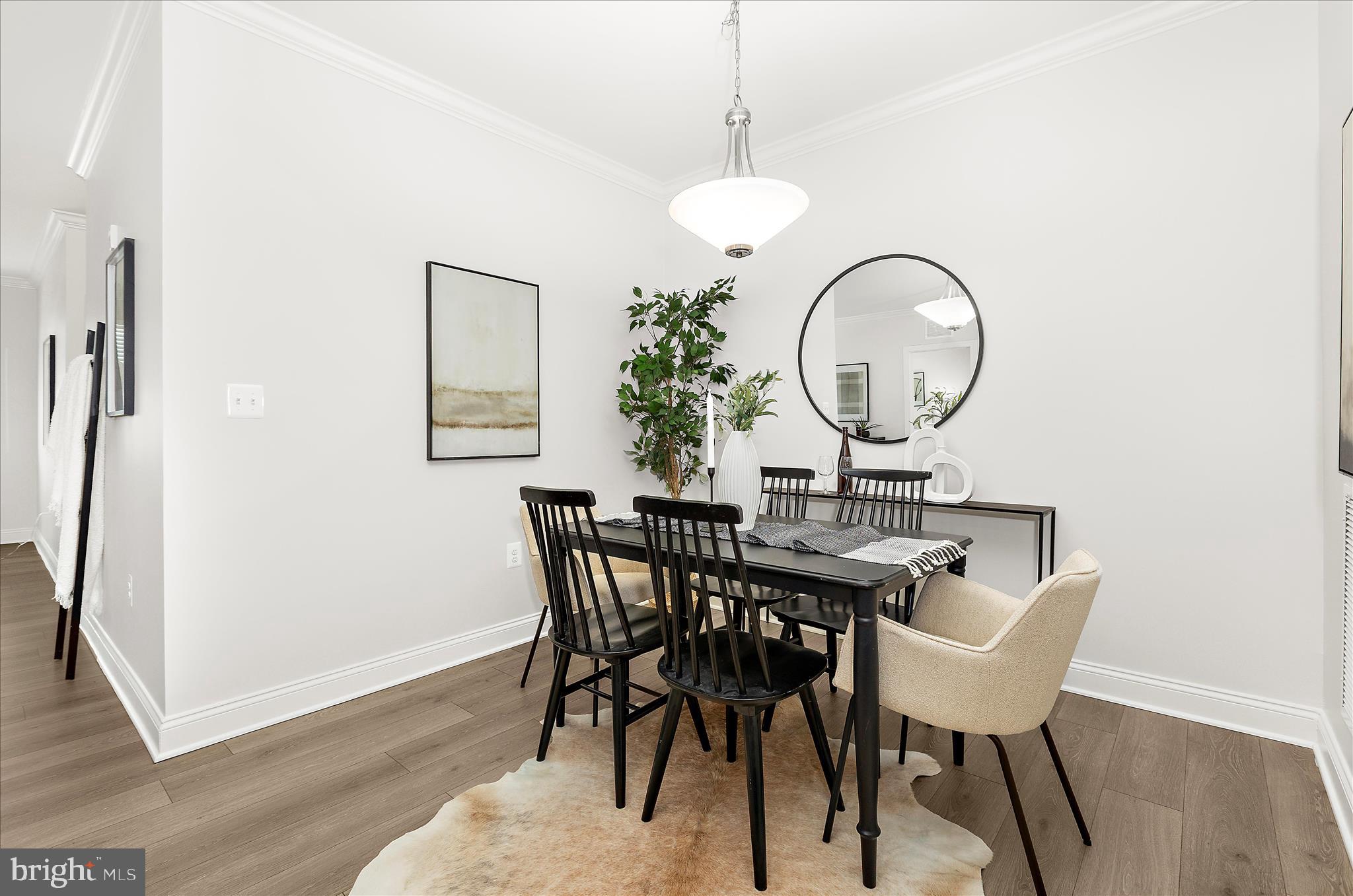 636 Wallingford Road, Unit 3J Bel Air, MD 21014 - Photo 11 of 59 a view of a dining room with furniture and wooden floor