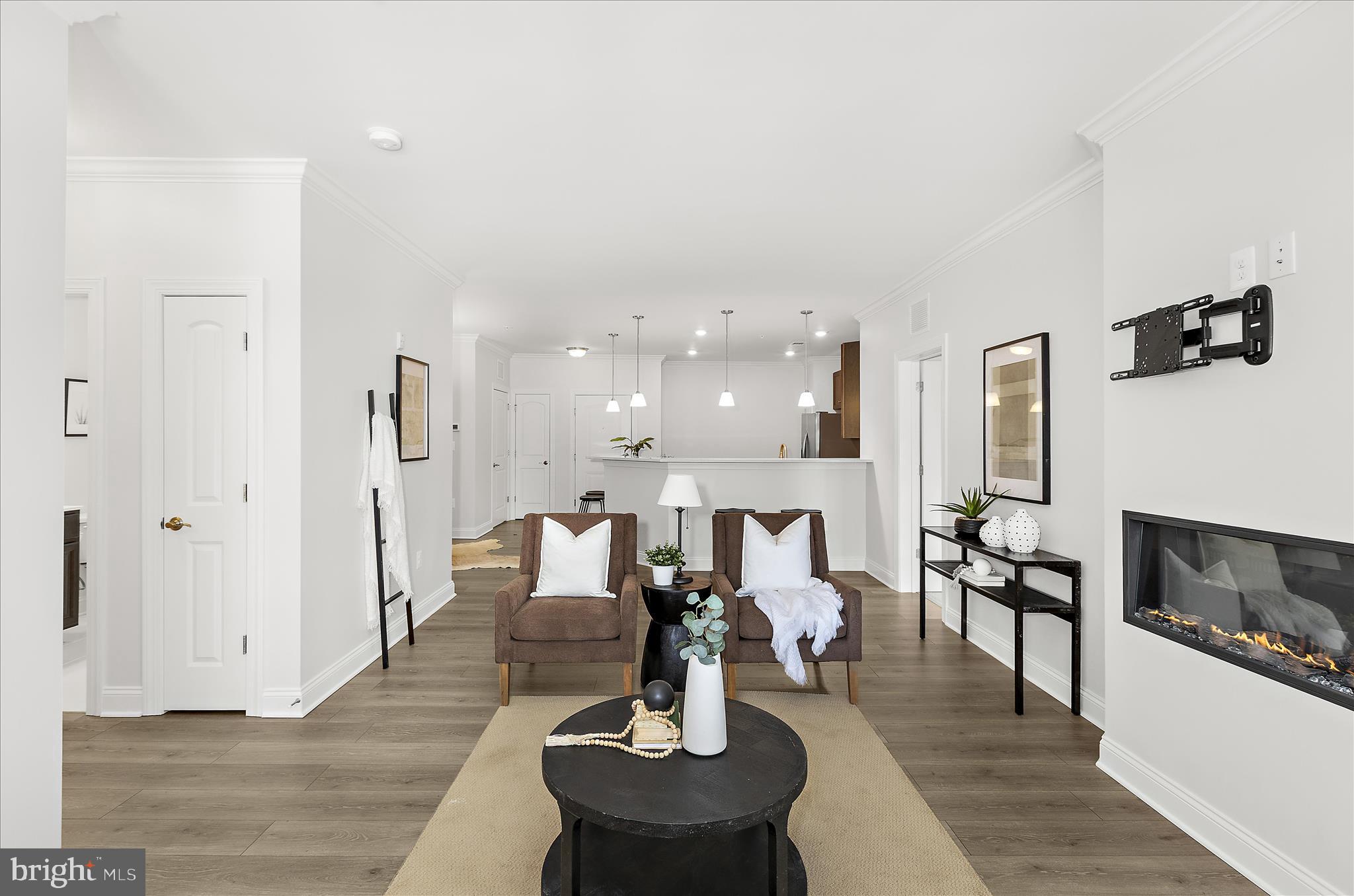636 Wallingford Road, Unit 3J Bel Air, MD 21014 - Photo 18 of 59 a living room with fireplace furniture and a wooden floor