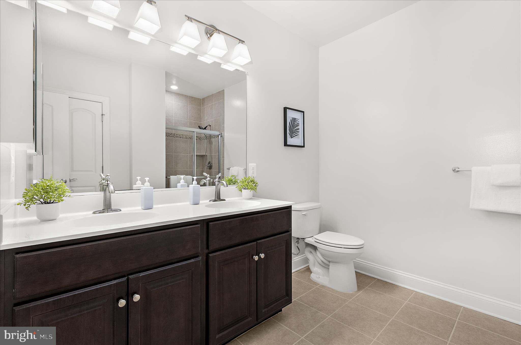 636 Wallingford Road, Unit 3J Bel Air, MD 21014 - Photo 28 of 59 a bathroom with a double vanity sink toilet and a mirror