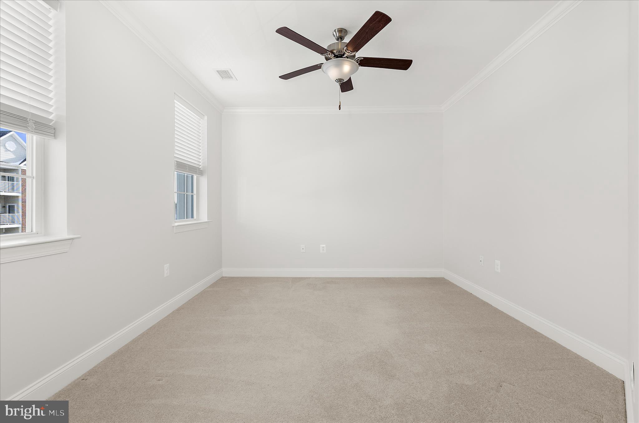 636 Wallingford Road, Unit 3J Bel Air, MD 21014 - Photo 31 of 59 an empty room with a window and a fan