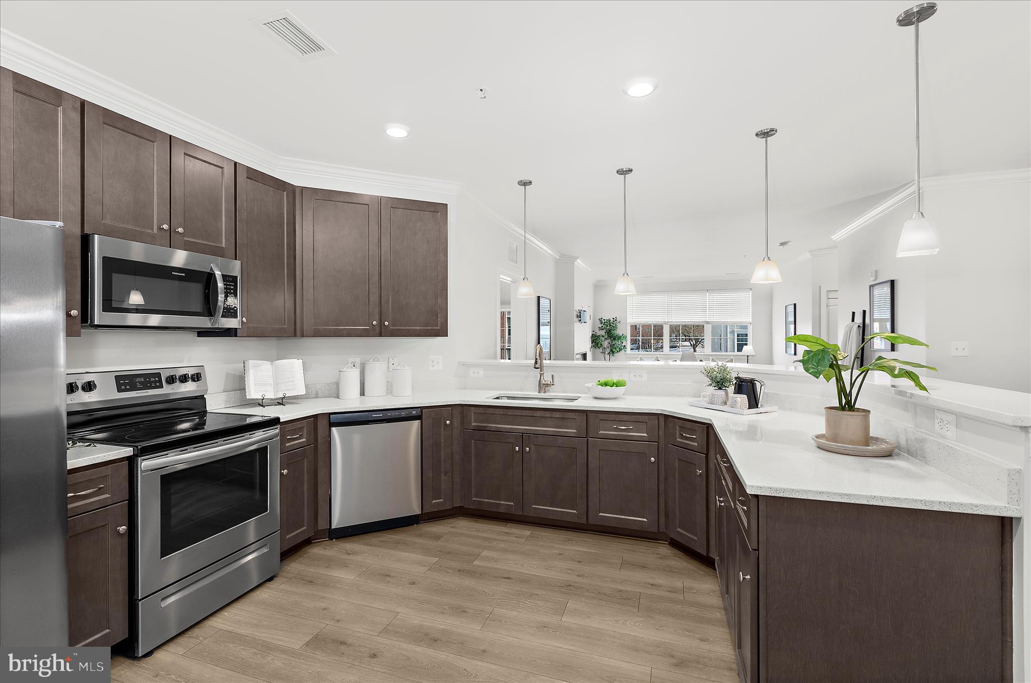 636 Wallingford Road, Unit 3J Bel Air, MD 21014 - Photo 9 of 59 a kitchen with stainless steel appliances granite countertop wooden cabinets stove a sink and dishwasher