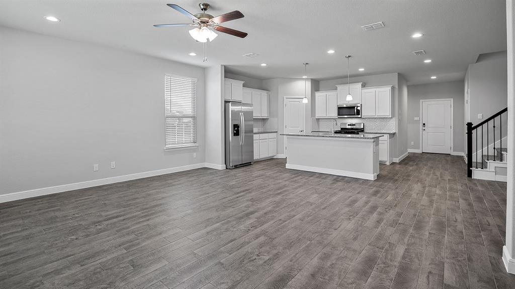 215 Windmill Drive Rhome, TX 76078 - Photo 12 of 37 a view of kitchen with sink microwave and refrigerator
