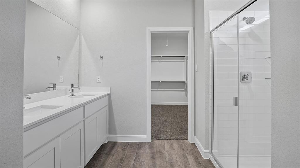 215 Windmill Drive Rhome, TX 76078 - Photo 16 of 37 a bathroom with a sink and a mirror