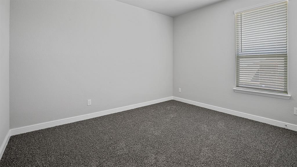 215 Windmill Drive Rhome, TX 76078 - Photo 24 of 37 a room that has a window in it