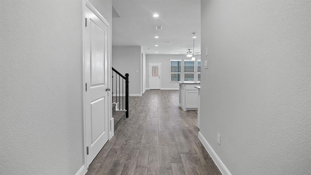 215 Windmill Drive Rhome, TX 76078 - Photo 30 of 37 a view of hallway with wooden floor