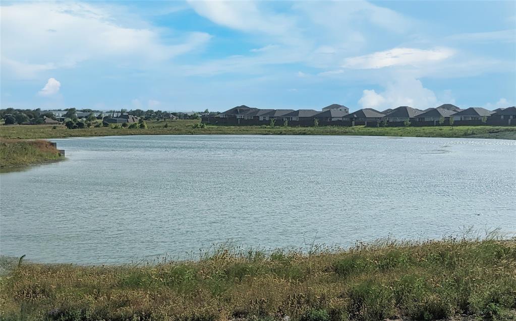 215 Windmill Drive Rhome, TX 76078 - Photo 33 of 37 a view of a lake and a yard