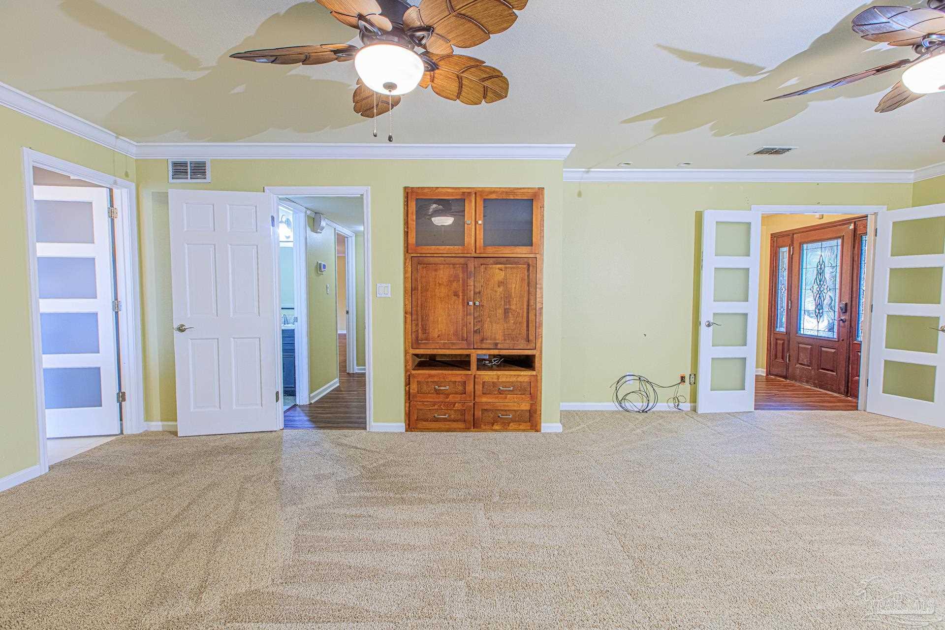 3777 Scenic Ridge Drive Pensacola, FL 32514 - Photo 16 of 67 a view of an empty room with window and cabinet