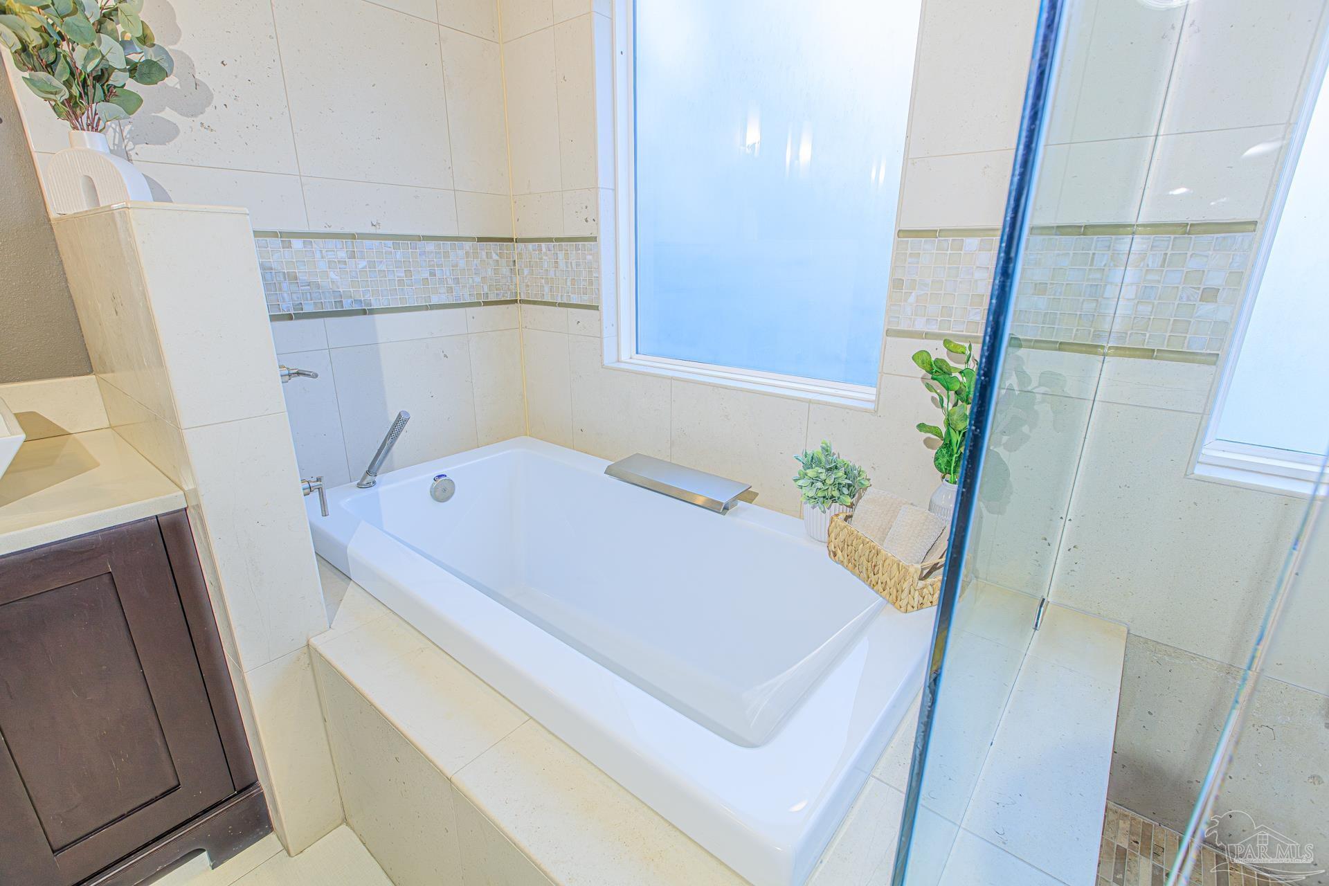 3777 Scenic Ridge Drive Pensacola, FL 32514 - Photo 19 of 67 a bath room with a sink and a bath tub