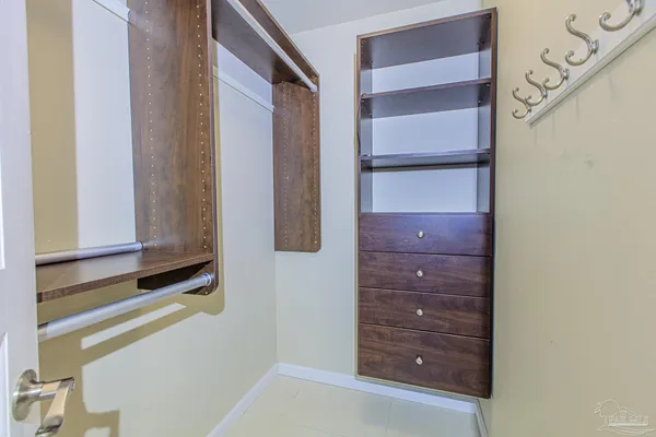 a bathroom with a granite countertop sink mirror vanity and toilet