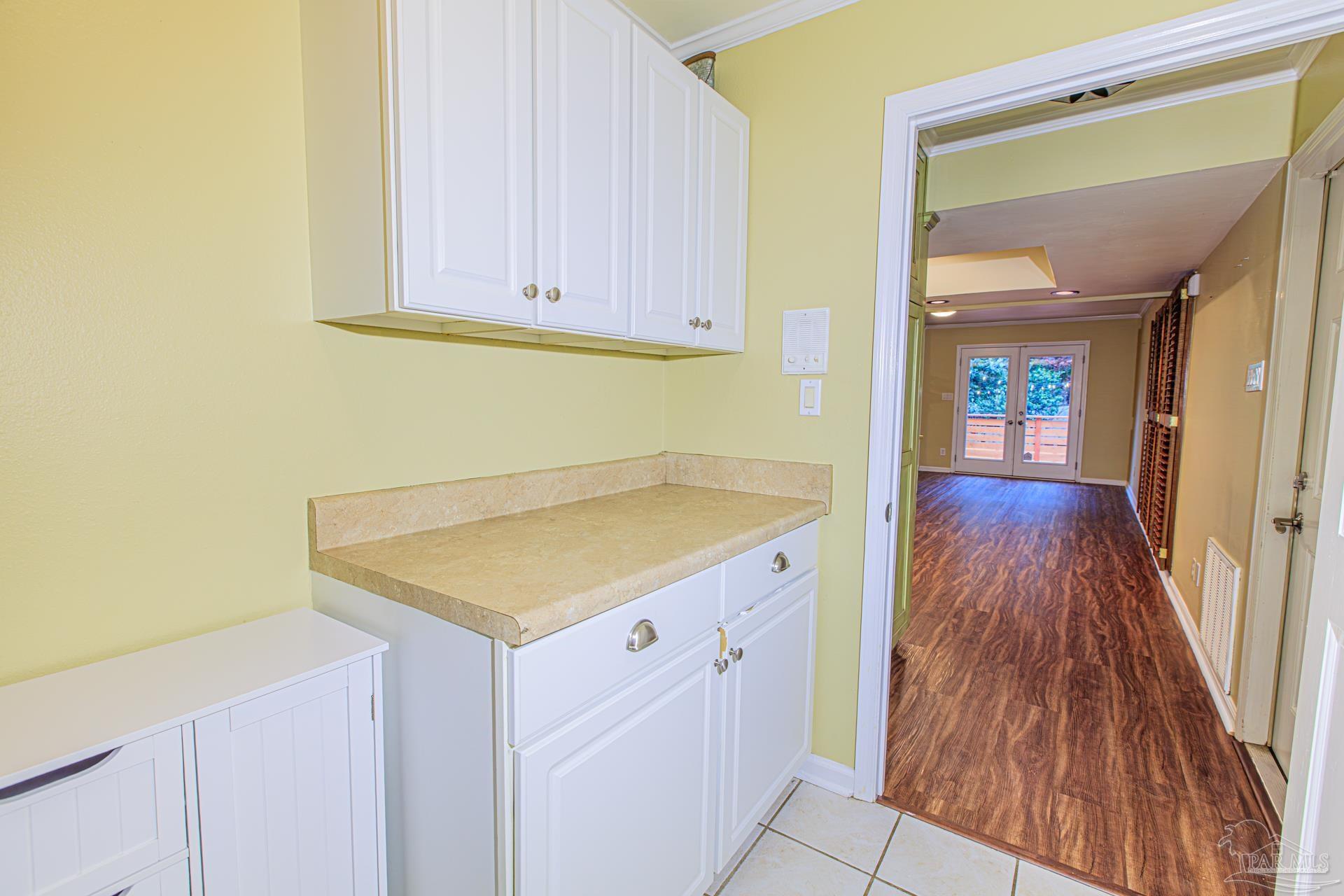 3777 Scenic Ridge Drive Pensacola, FL 32514 - Photo 28 of 67 a view of a kitchen with wooden floor and cabinets