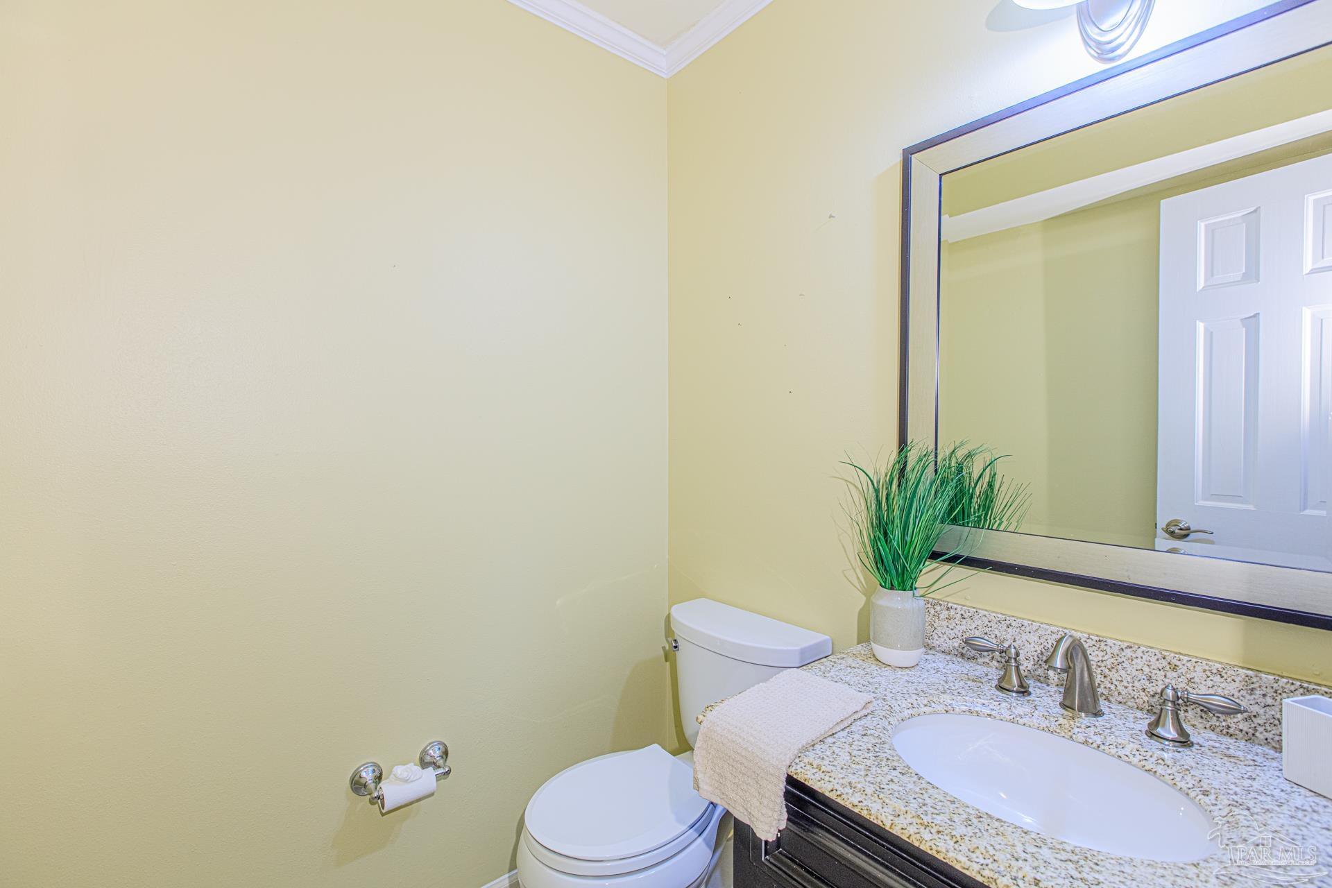 3777 Scenic Ridge Drive Pensacola, FL 32514 - Photo 29 of 67 a bathroom with a granite countertop sink mirror vanity and toilet