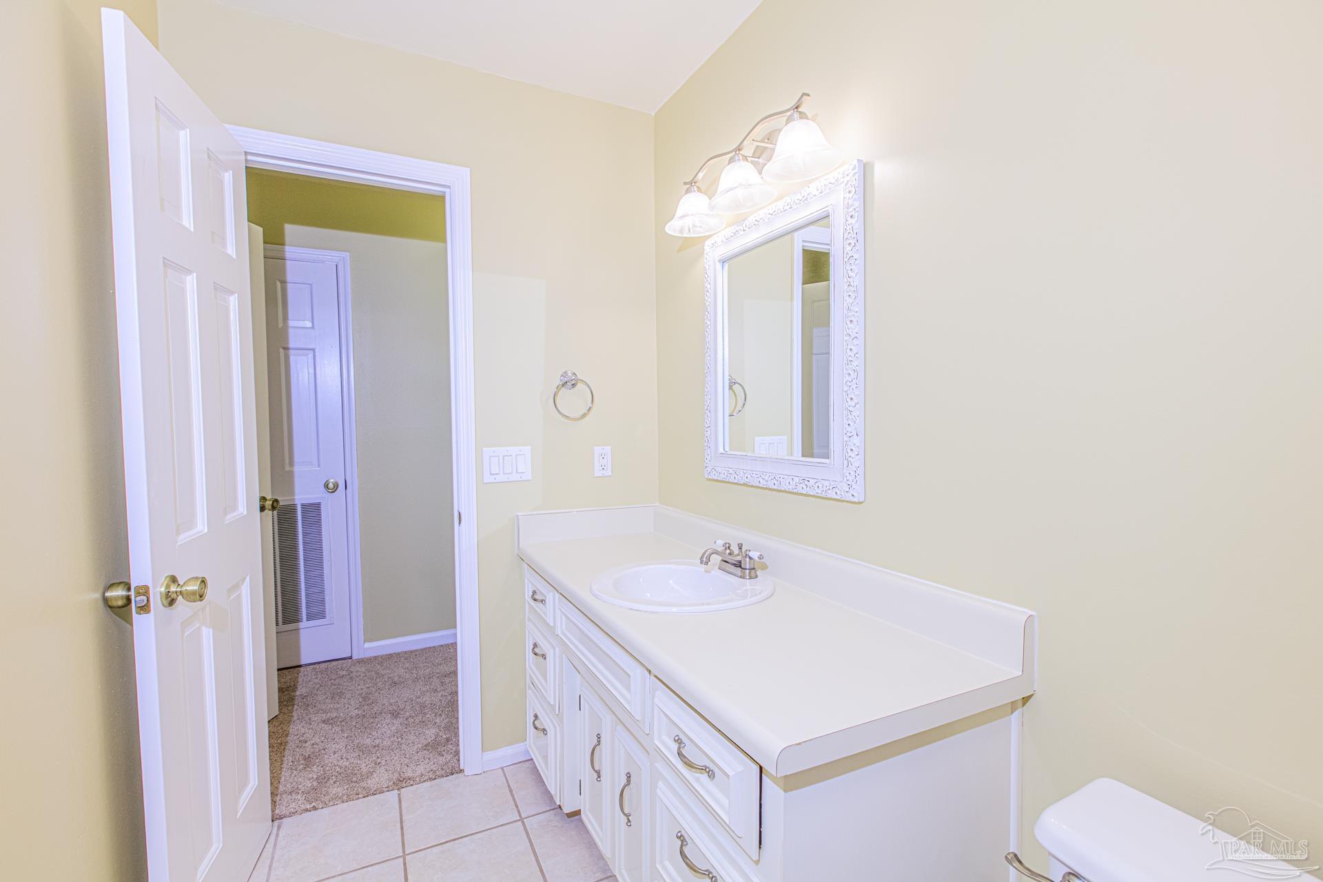 3777 Scenic Ridge Drive Pensacola, FL 32514 - Photo 39 of 67 a bathroom with a sink a toilet and shower