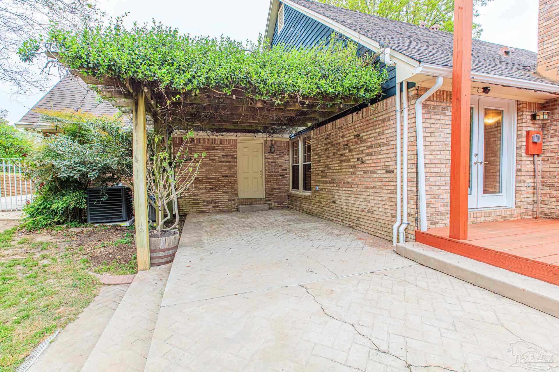 3777 Scenic Ridge Drive Pensacola, FL 32514 - Photo 56 of 67 a backyard of a house with lots of green space