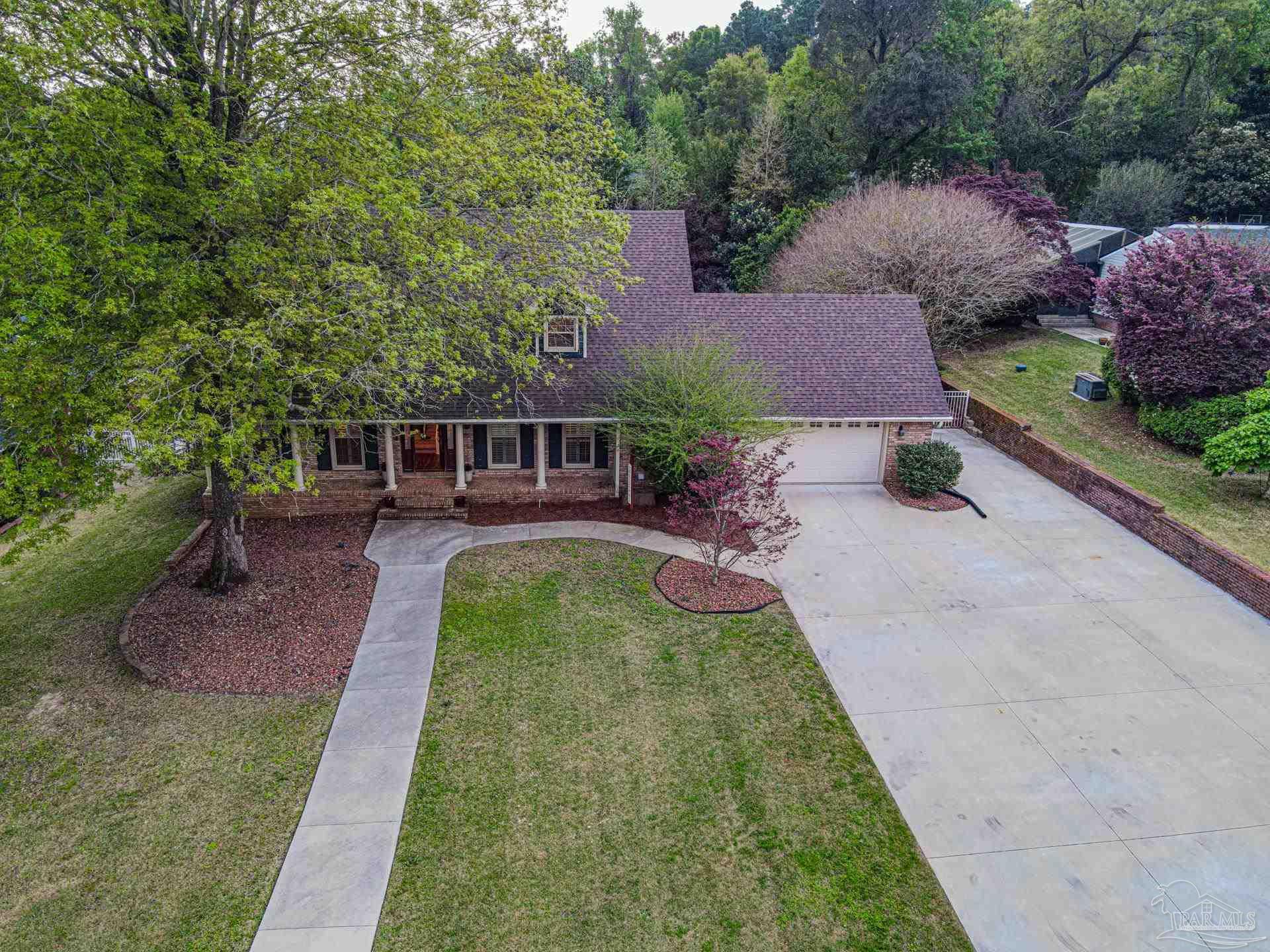 3777 Scenic Ridge Drive Pensacola, FL 32514 - Photo 61 of 67 an aerial view of a house with swimming pool and patio