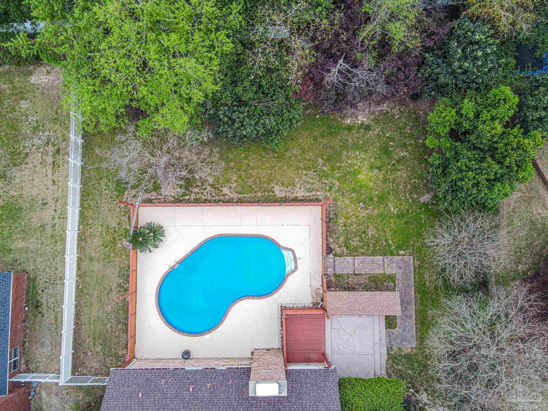 3777 Scenic Ridge Drive Pensacola, FL 32514 - Photo 62 of 67 an aerial view of a house with a yard and large trees