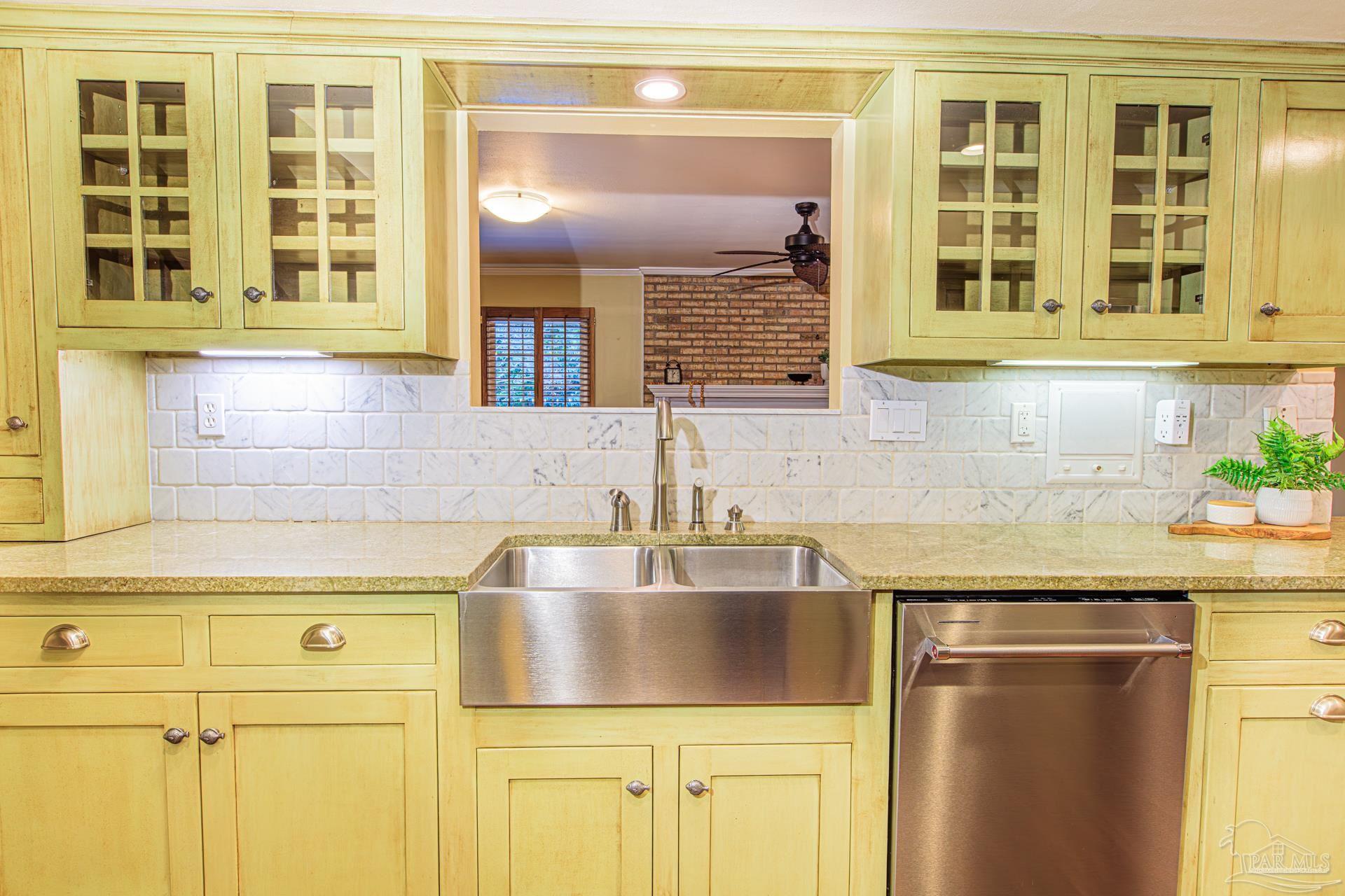 3777 Scenic Ridge Drive Pensacola, FL 32514 - Photo 10 of 67 a kitchen with a sink and cabinets