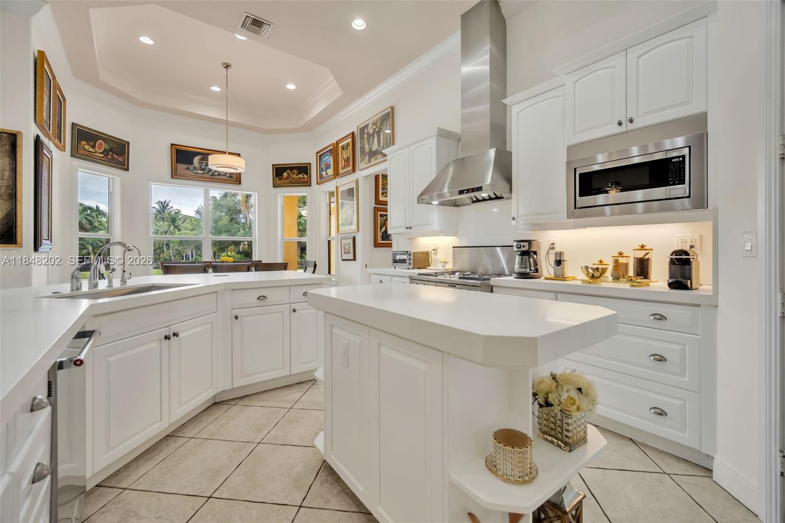14211 Southwest 63rd Street Southwest Ranches, FL 33330 - Photo 14 of 81 a kitchen with stainless steel appliances granite countertop a sink and cabinets