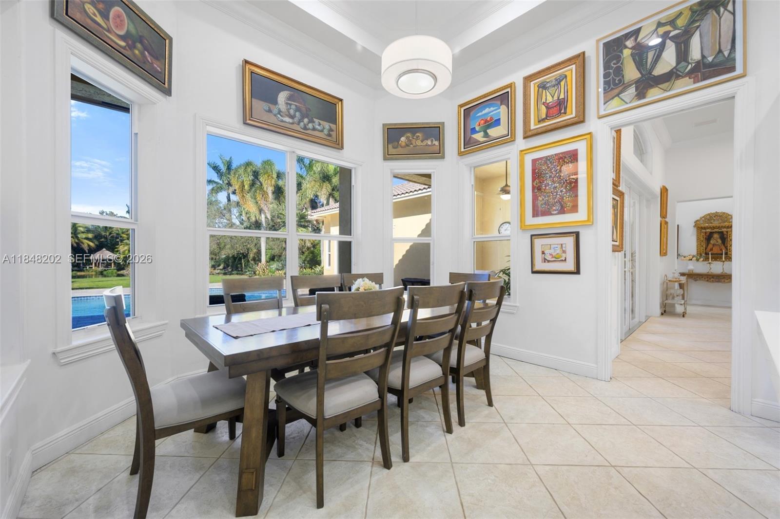 14211 Southwest 63rd Street Southwest Ranches, FL 33330 - Photo 18 of 81 a dining room with furniture and window