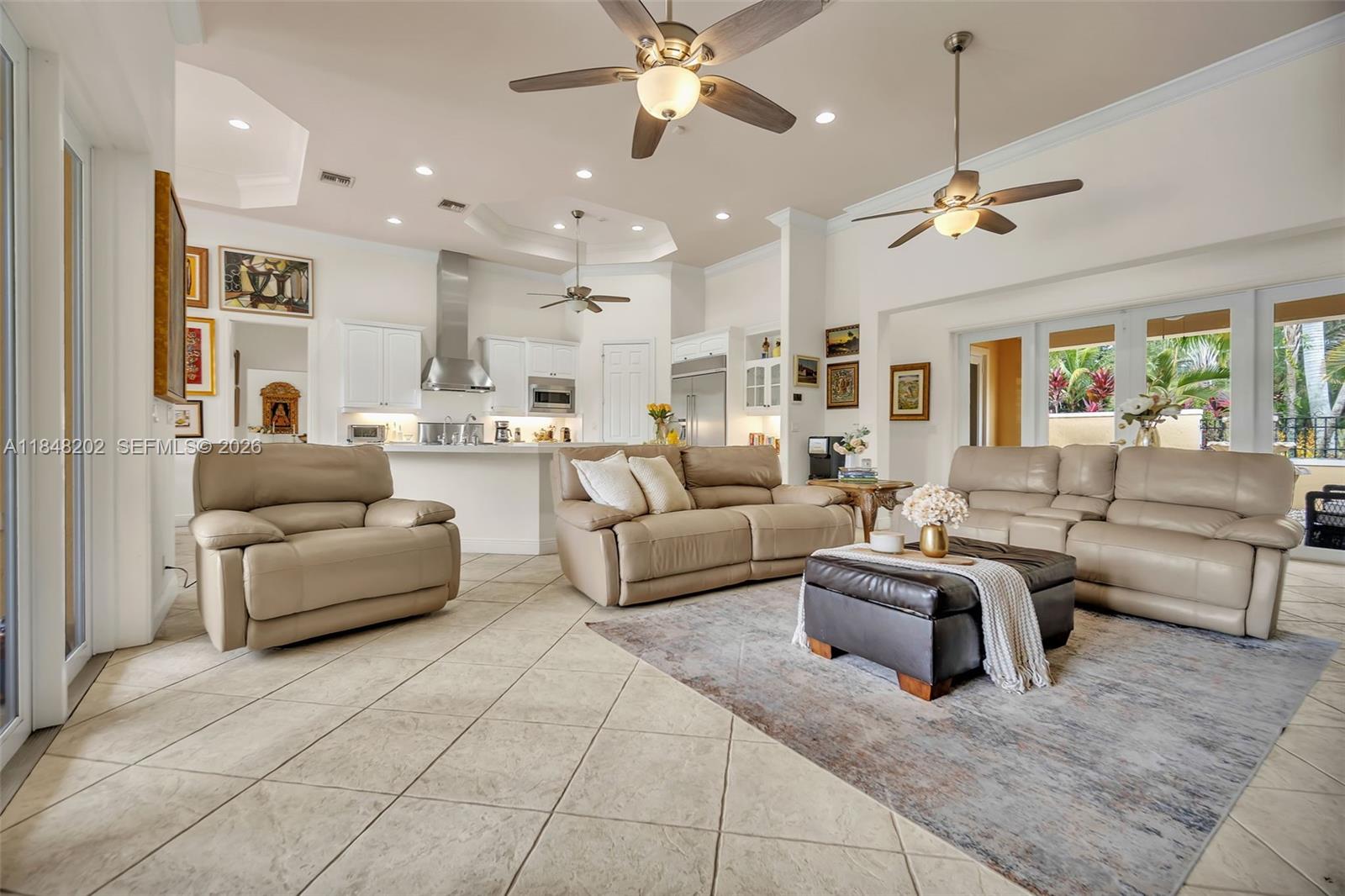 14211 Southwest 63rd Street Southwest Ranches, FL 33330 - Photo 19 of 81 a living room with furniture and a chandelier