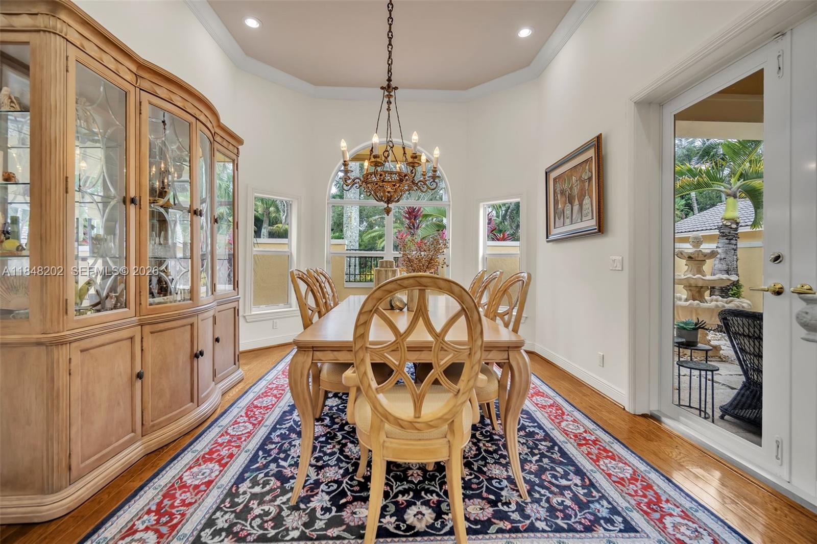 14211 Southwest 63rd Street Southwest Ranches, FL 33330 - Photo 23 of 81 a view of a dining room with furniture window and wooden floor