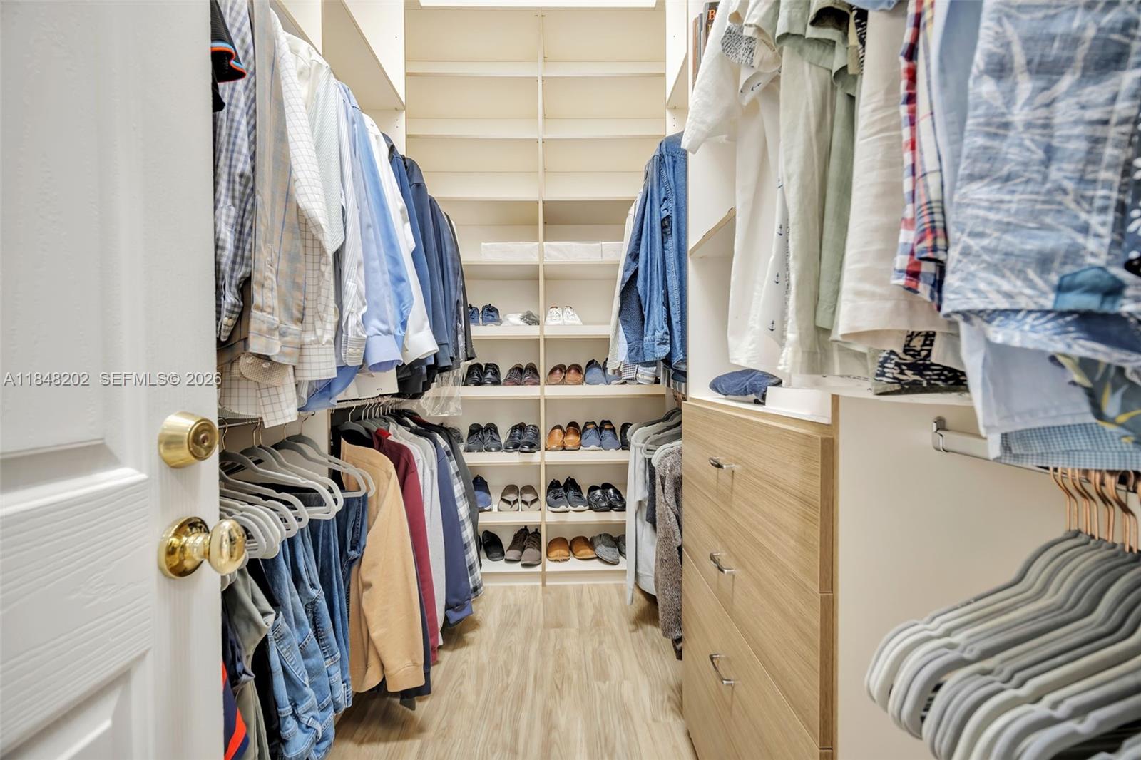 14211 Southwest 63rd Street Southwest Ranches, FL 33330 - Photo 36 of 81 a view of walk in closet with clothes and shoes