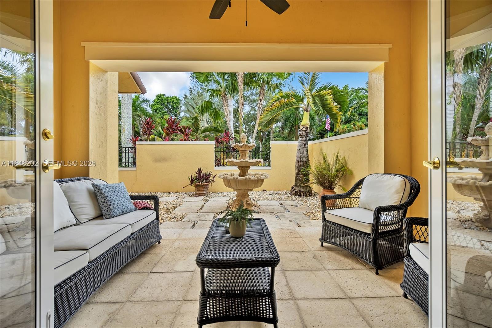 14211 Southwest 63rd Street Southwest Ranches, FL 33330 - Photo 38 of 81 a living room with furniture and a large window
