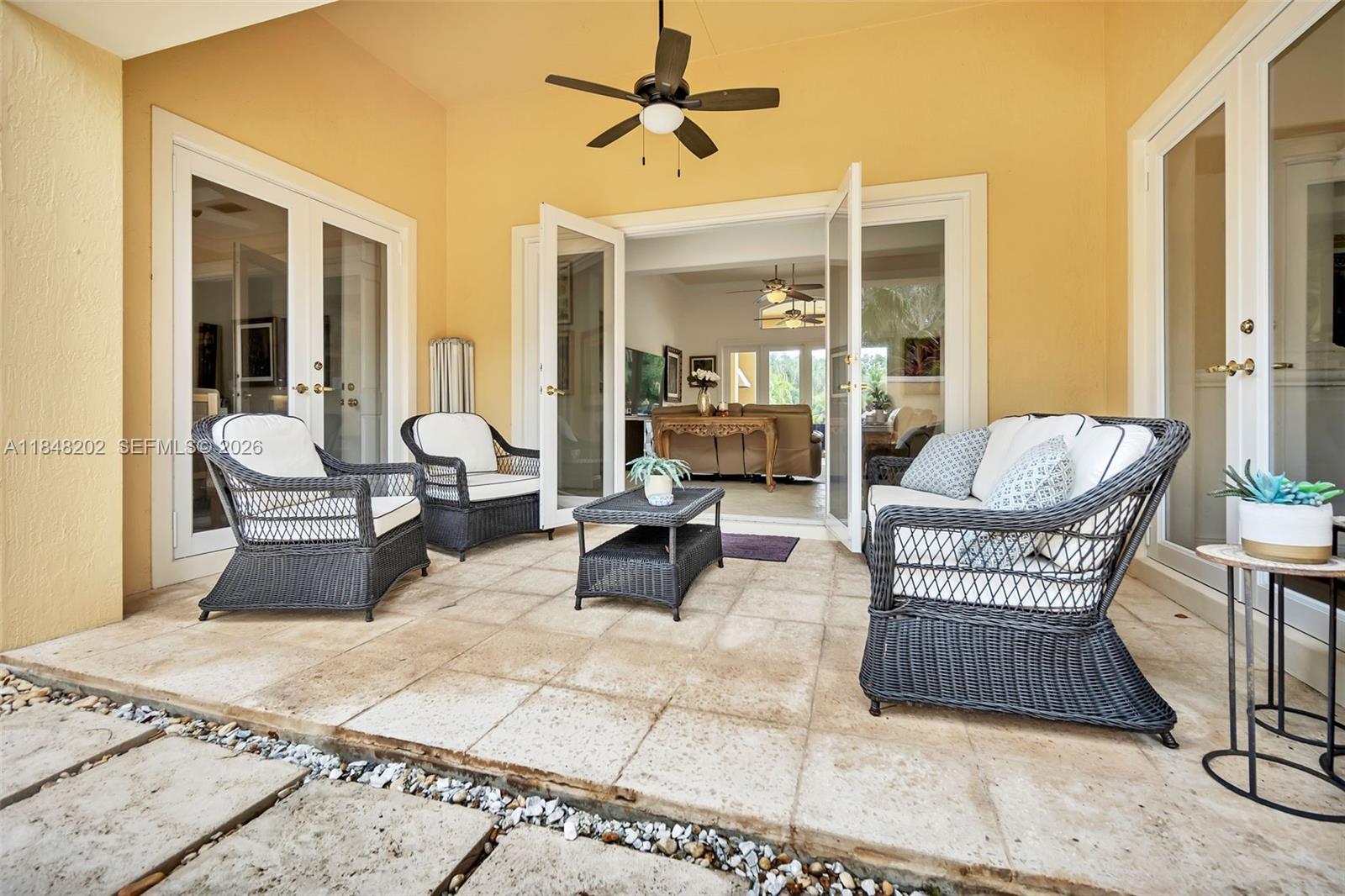 14211 Southwest 63rd Street Southwest Ranches, FL 33330 - Photo 39 of 81 a living room with furniture and a chandelier