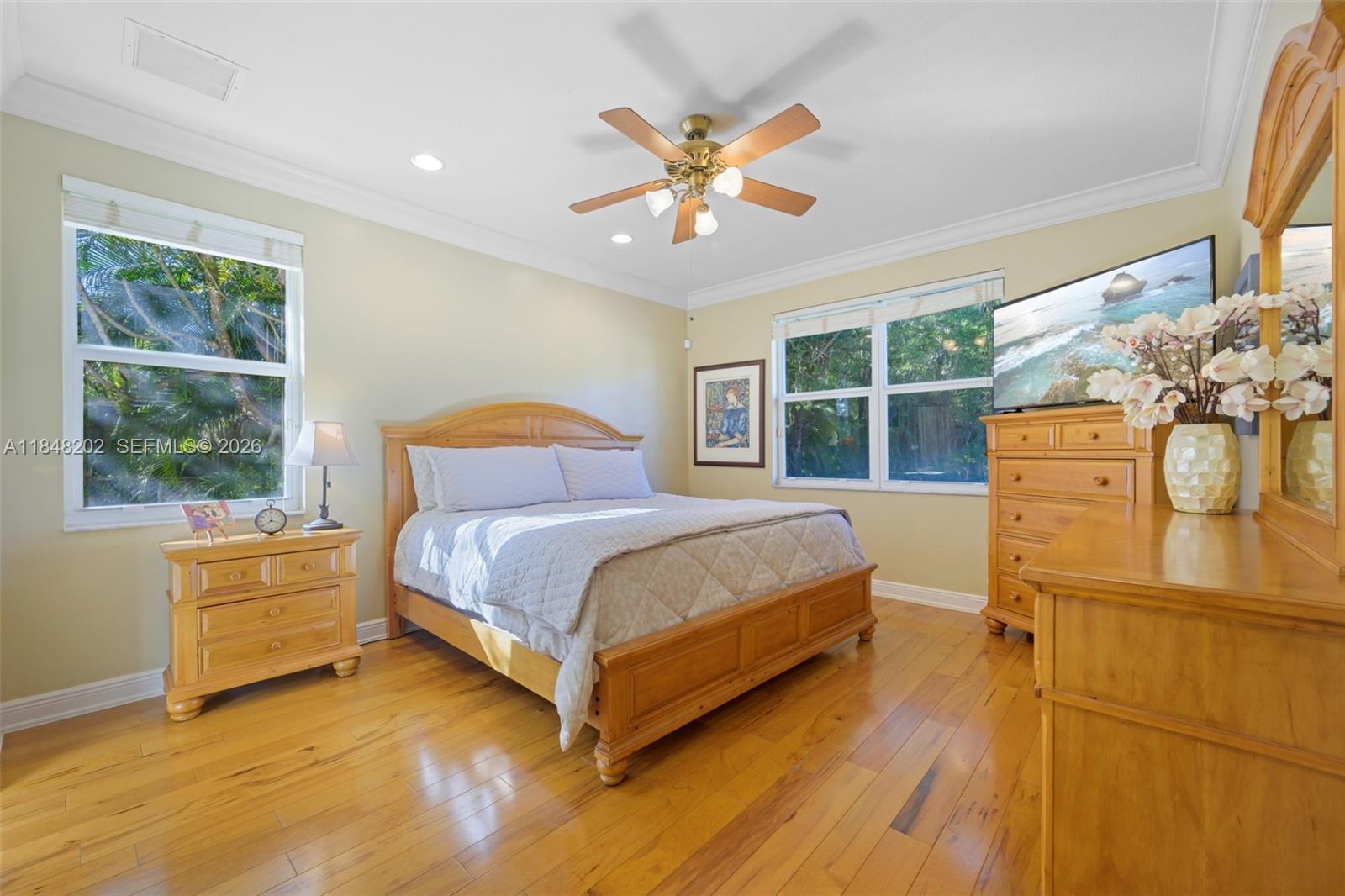 14211 Southwest 63rd Street Southwest Ranches, FL 33330 - Photo 41 of 81 a bedroom with a bed and a large window with outer view
