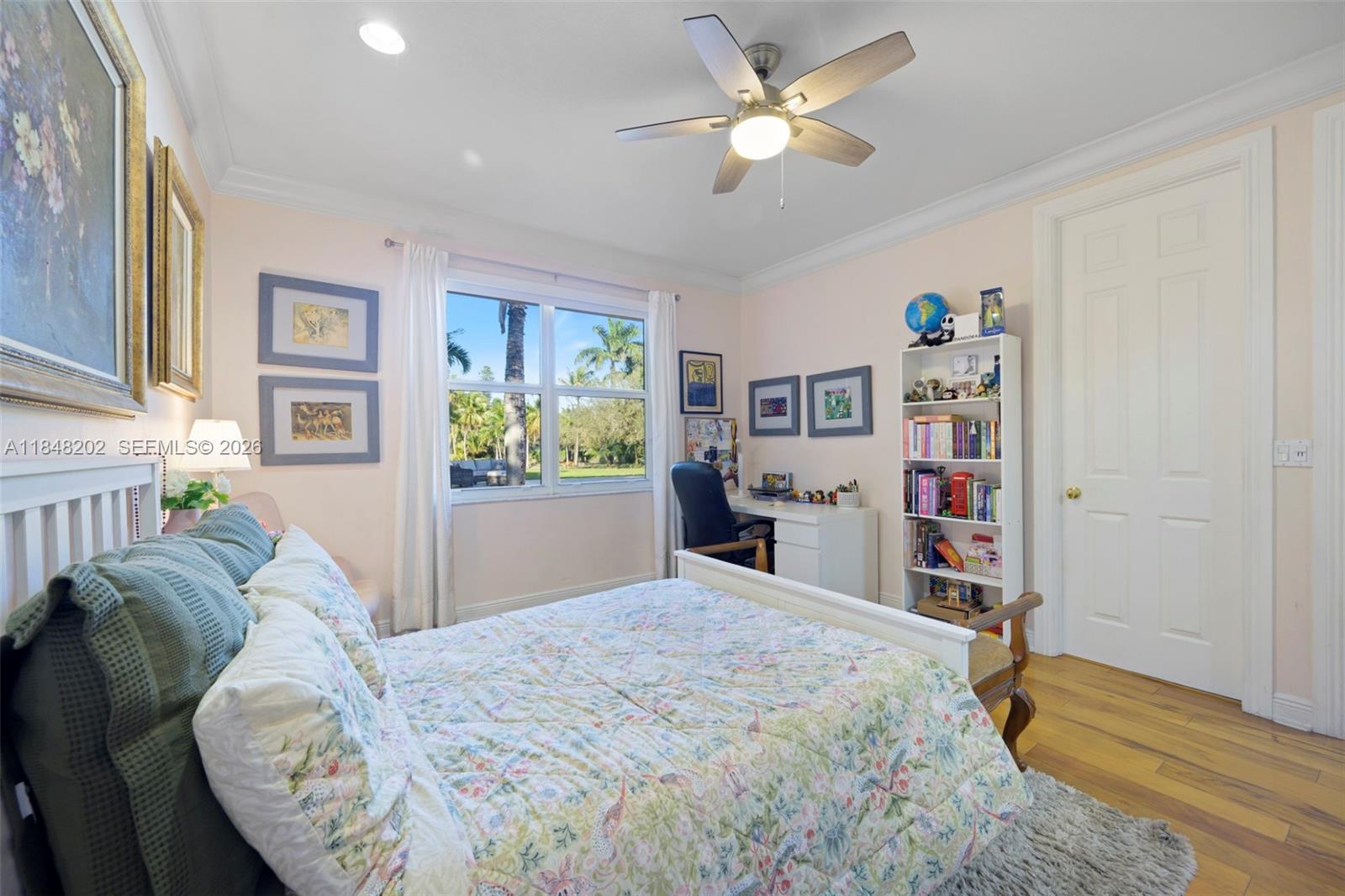 14211 Southwest 63rd Street Southwest Ranches, FL 33330 - Photo 43 of 81 a bedroom with a bed dresser and a window