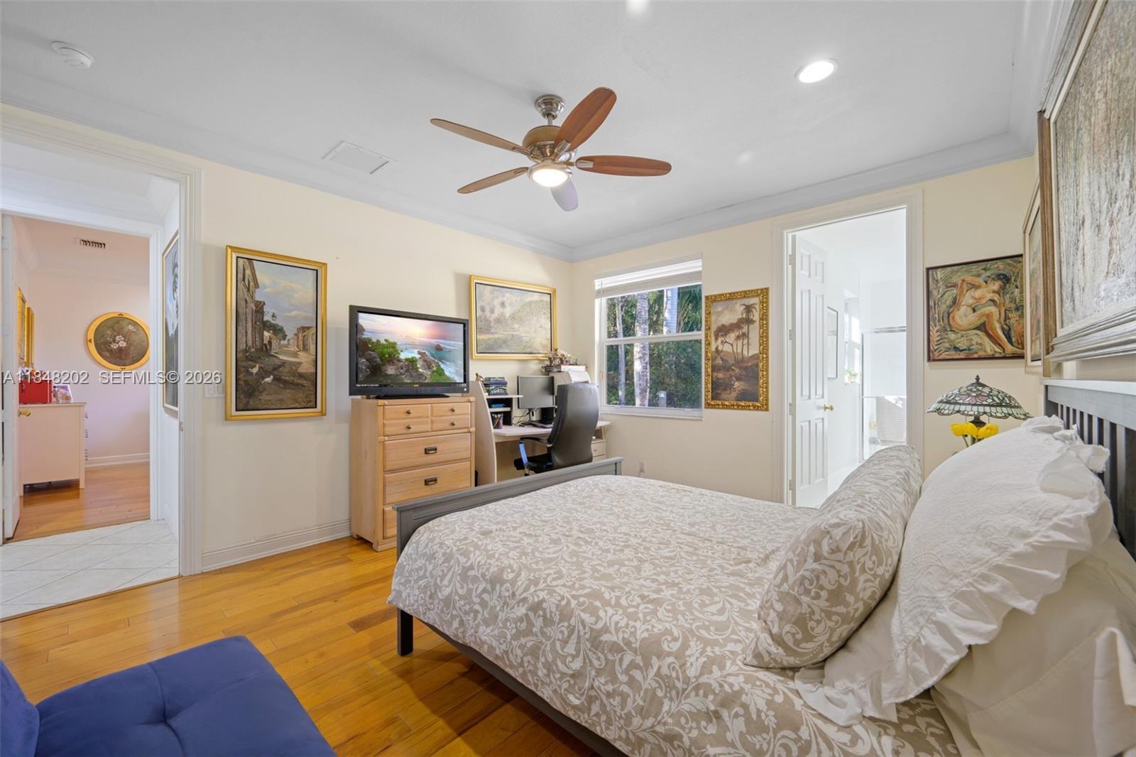 14211 Southwest 63rd Street Southwest Ranches, FL 33330 - Photo 47 of 81 a bedroom with a bed a window and flat screen tv