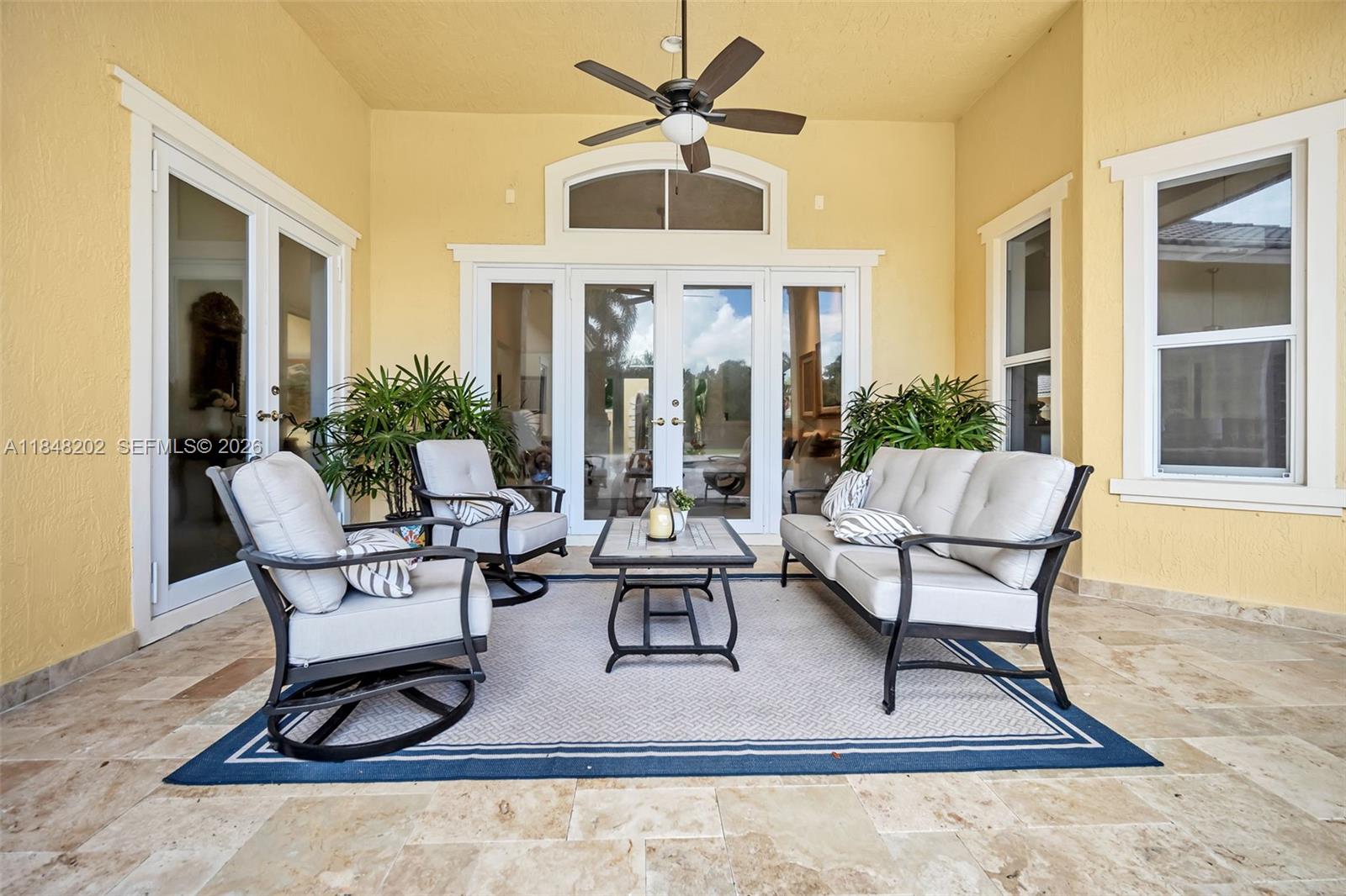 14211 Southwest 63rd Street Southwest Ranches, FL 33330 - Photo 51 of 81 a building outdoor space with patio furniture and wooden floor