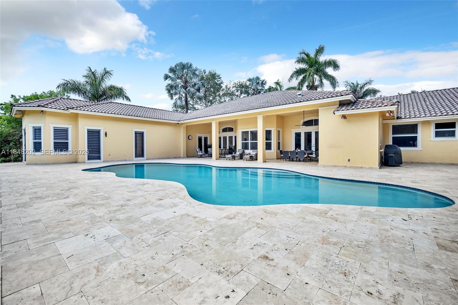 14211 Southwest 63rd Street Southwest Ranches, FL 33330 - Photo 57 of 81 front view of a house with a swimming pool
