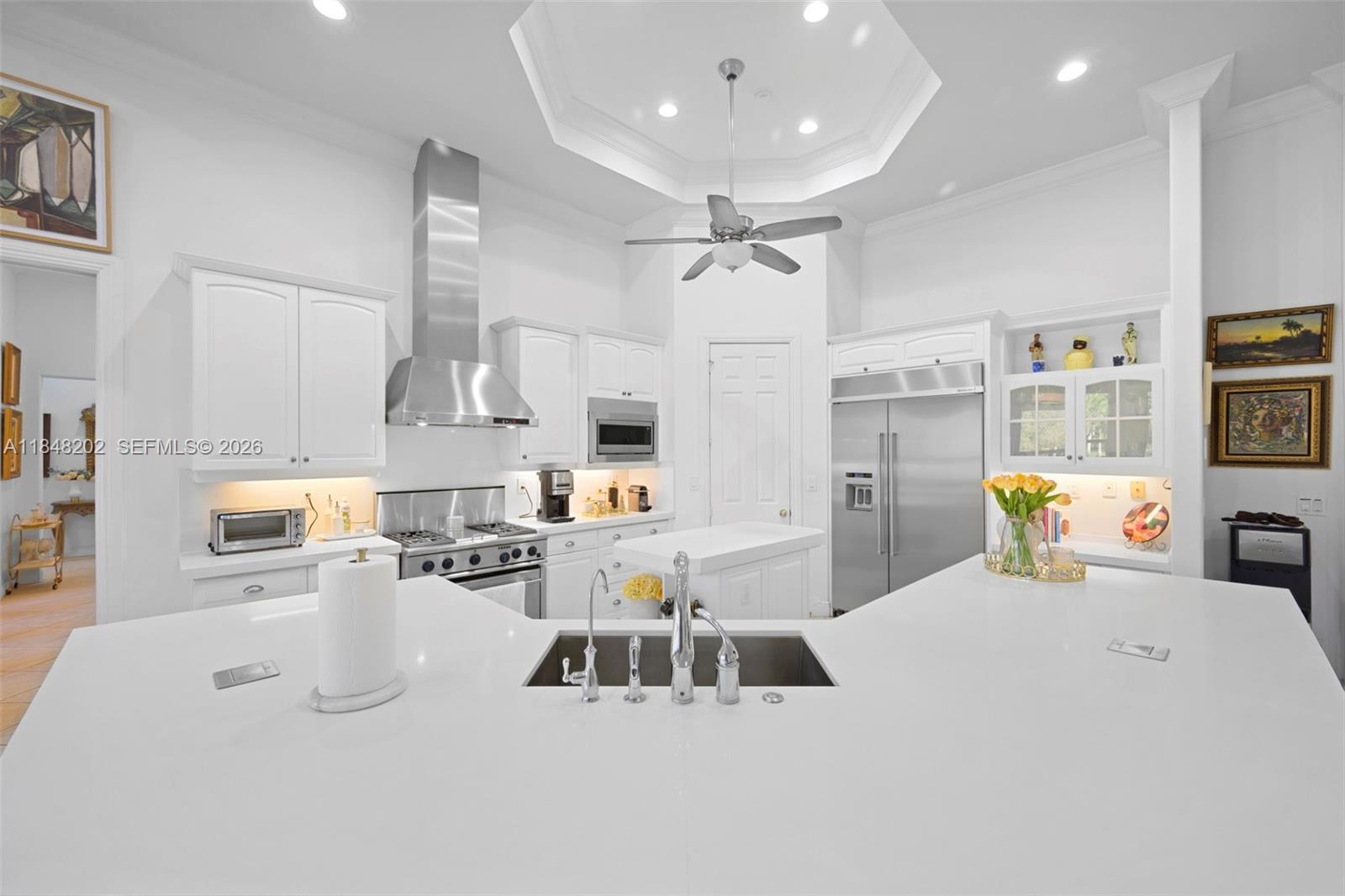 14211 Southwest 63rd Street Southwest Ranches, FL 33330 - Photo 9 of 81 a kitchen with refrigerator and washer