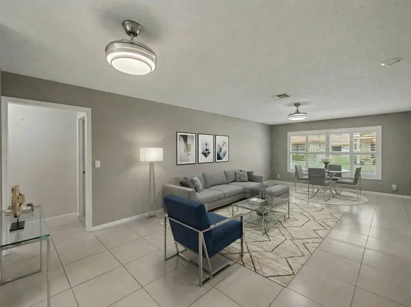 a living room with furniture and a table