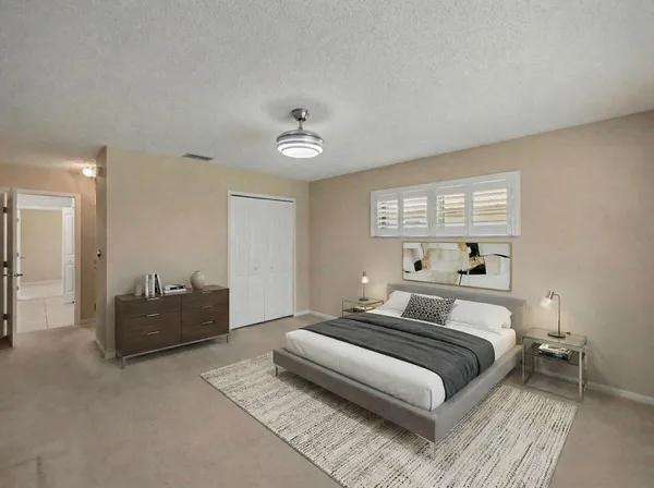 a bedroom with a bed and a couch