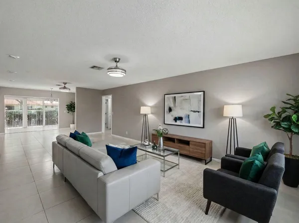 a living room with furniture and a window