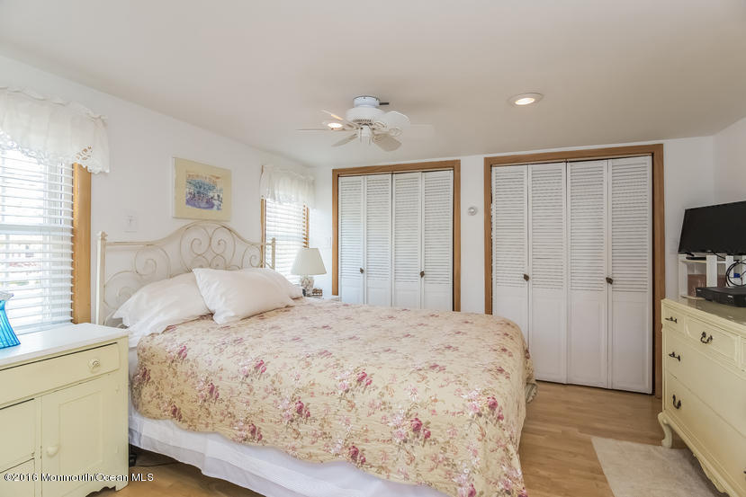 737 Wall Road Spring Lake Heights, NJ 07762 - Photo 15 of 26 a bedroom with a bed and a flat screen tv