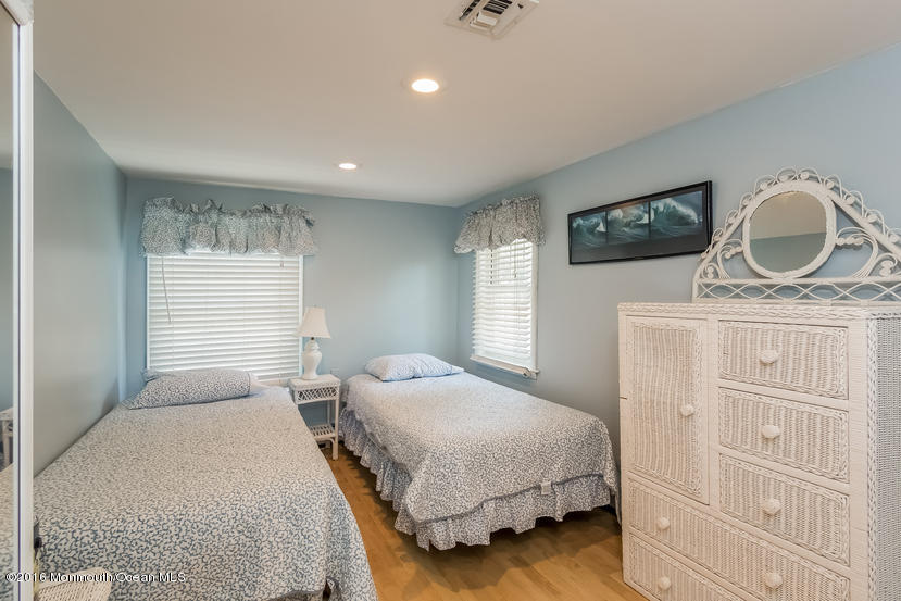 737 Wall Road Spring Lake Heights, NJ 07762 - Photo 17 of 26 a bedroom with a bed and a window