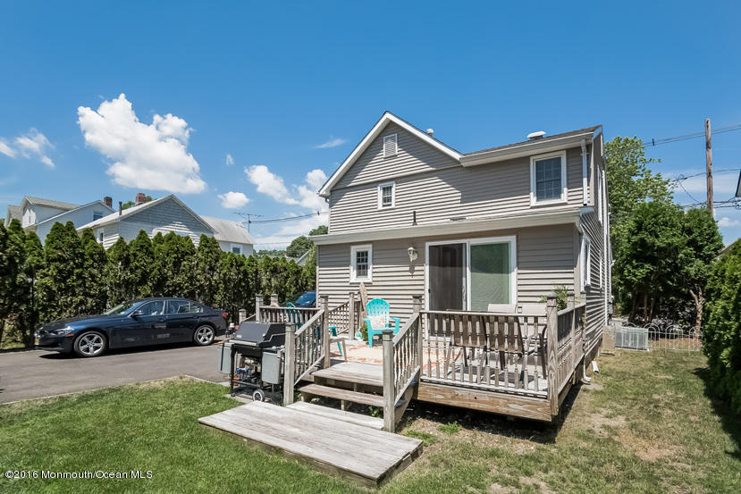 737 Wall Road Spring Lake Heights, NJ 07762 - Photo 22 of 26 a view of a deck with a wooden fence