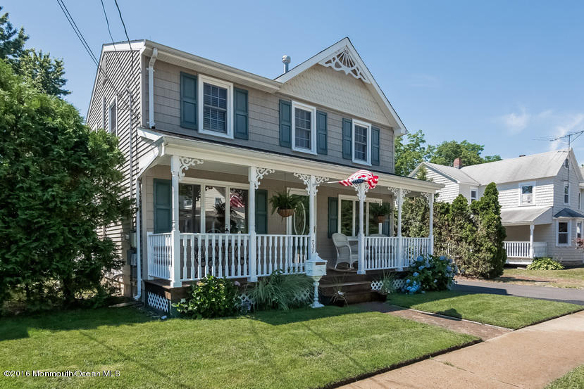 737 Wall Road Spring Lake Heights, NJ 07762 - Photo 3 of 26 a front view of a house with a garden and plants