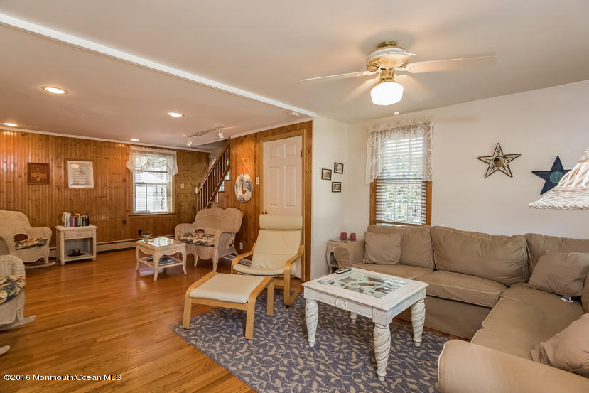 737 Wall Road Spring Lake Heights, NJ 07762 - Photo 5 of 26 a living room with furniture a table and a large window