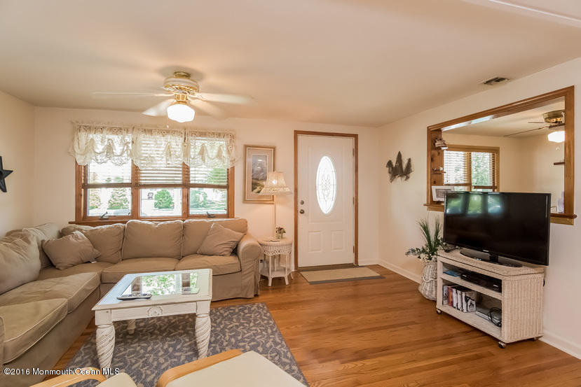 737 Wall Road Spring Lake Heights, NJ 07762 - Photo 6 of 26 a living room with furniture and a flat screen tv