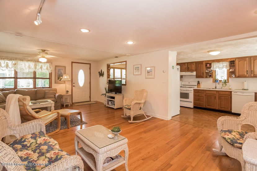 737 Wall Road Spring Lake Heights, NJ 07762 - Photo 7 of 26 a living room with furniture and a kitchen