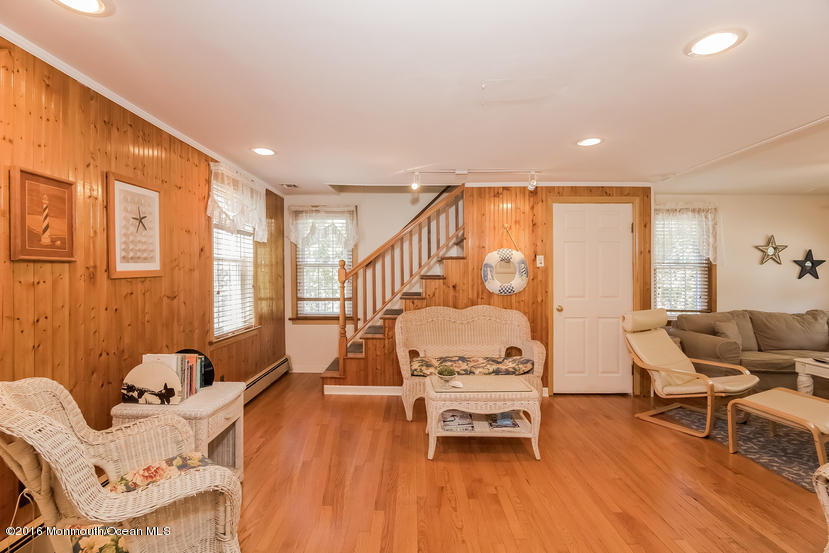 737 Wall Road Spring Lake Heights, NJ 07762 - Photo 8 of 26 a living room with furniture and wooden floor