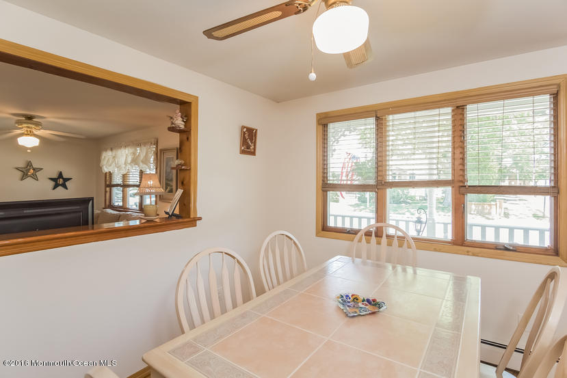 737 Wall Road Spring Lake Heights, NJ 07762 - Photo 10 of 26 a dining room with furniture and wooden floor