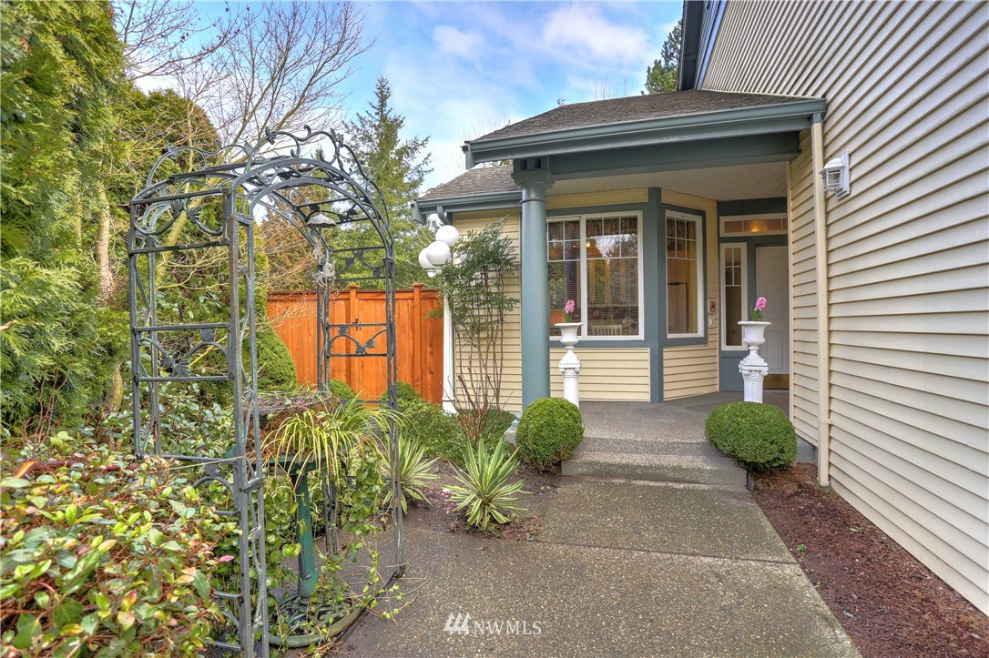 672 Chelan Place Northeast Renton, WA 98059 - Photo 3 of 24 a house with potted plant in front of it
